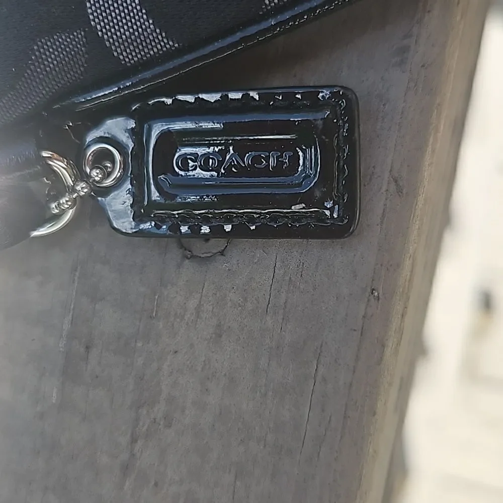 Coach Op Art logo wristlet